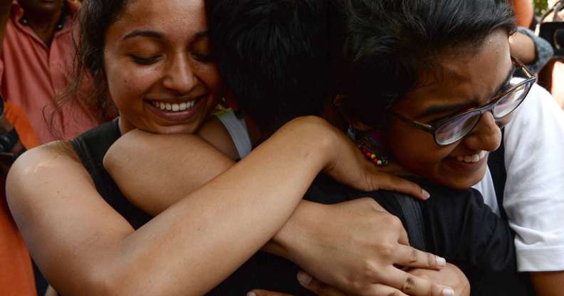 Indian members of the lesbian, gay, bisexual, transgender (LGBT) community celebrate outside the Supreme Court after the decision to strike down the colonial-era ban on gay sex in New Delhi on September 6, 2018. - India's Supreme Court on September 6 struck down the ban that has been at the centre of years of legal battles. "The law had become a weapon for harassment for the LGBT community," Chief Justice Dipak Misra said as he announced the landmark verdict. (Photo by Sajjad HUSSAIN / AFP) (Photo credit should read SAJJAD HUSSAIN/AFP/Getty Images)