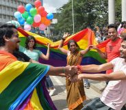 Indian members and supporters of the LGBT community celebrate the Supreme Court decision to strike down a colonial-era ban on gay sex, in Bangalore on September 6, 2018. (MANJUNATH KIRAN/AFP/Getty Images)