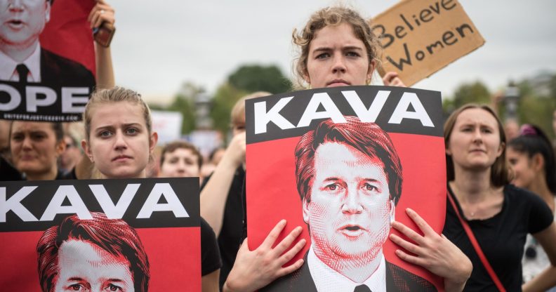 TOPSHOT - Women demonstrators protest against the appointment of Supreme Court nominee Brett Kavanaugh at the US Capitol in Washington DC, on October 6, 2018. - The US Senate confirmed conservative judge Kavanaugh as the next Supreme Court justice on October 6, offering US President Donald Trump a big political win and tilting the nation's high court decidedly to the right. (Photo by ROBERTO SCHMIDT / AFP) (Photo credit should read ROBERTO SCHMIDT/AFP/Getty Images)