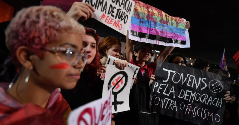 Demonstrators take part in a protest against Brazilian right-wing presidential candidate Jair Bolsonaro in Sao Paulo, Brazil, on October 10 2018. - The populist ultra-conservative won 46 percent of the vote in the first round, despite detractors highlighting his contentious past comments demeaning women and gays, and speaking in favor of torture and Brazil's 1964-1985 military dictatorship. Brazil will hold the run-off presidential election next October 28. (Photo by NELSON ALMEIDA / AFP) (Photo credit should read NELSON ALMEIDA/AFP/Getty Images)