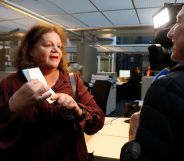 Leonne Zeegers, 57, receives a passeport with the gender designation X, instead of M for man or V for woman in Breda, on October 19, 2018. - The first gender-neutral passport of The Netherlands was issued. (Photo by Bas Czerwinski / ANP / AFP) / Netherlands OUT (Photo credit should read BAS CZERWINSKI/AFP/Getty Images)