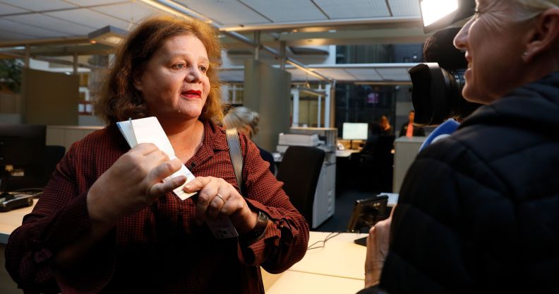 Leonne Zeegers, 57, receives a passeport with the gender designation X, instead of M for man or V for woman in Breda, on October 19, 2018. - The first gender-neutral passport of The Netherlands was issued. (Photo by Bas Czerwinski / ANP / AFP) / Netherlands OUT (Photo credit should read BAS CZERWINSKI/AFP/Getty Images)