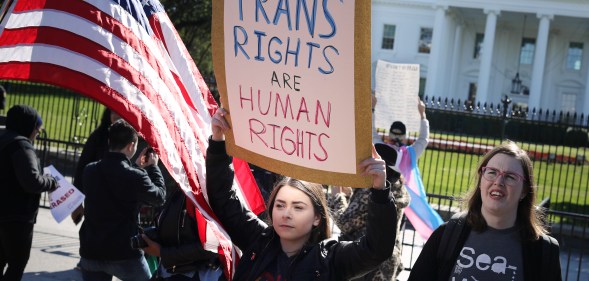 A 'We Will Not Be Erased' rally in front of the White House October 22, 2018, afterthe New York Times published news of an unreleased Trump administration memo that proposes a trans-exclusive legal definition of gender. (Chip Somodevilla/Getty)