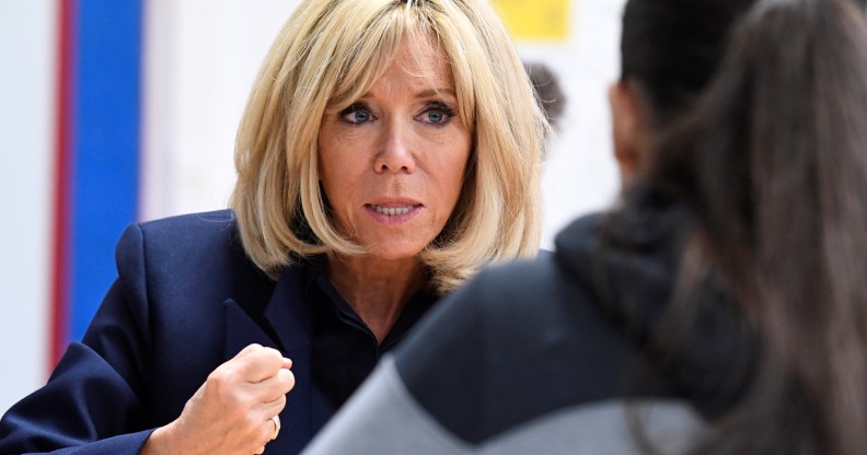 French President's wife Brigitte Macron gestures as she speaks to children during a visit to raise awareness about bullying in Clamart, near Paris, on November 15, 2018.