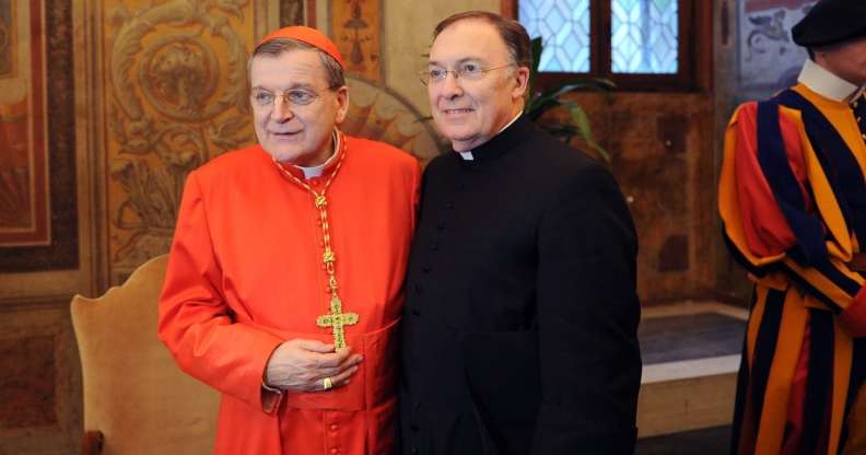 Newly appointed cardinal, US Raymond leo Burke (L) poses with a member of the clergy during the traditionnal courtesy visit after the consistory on November 20, 2010 at The Vatican. 24 Roman Catholic prelates joined the Vatican's College of Cardinals, the elite body that advises the pontiff and elects his successor upon his death. AFP PHOTO / ALBERTO PIZZOLI (Photo credit should read ALBERTO PIZZOLI/AFP/Getty Images)