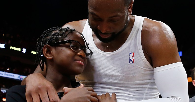 Dwyane Wade hugs his son Zion