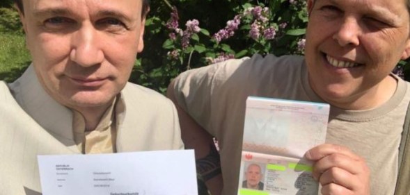 Intersex activist Alex Jurgen (R) receives Austria's first-ever documents recognising a third gender option.