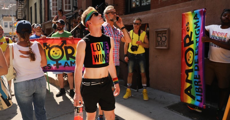 People gather outside Stonewall Inn for rally.