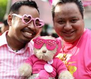 SINGAPORE - JUNE 30: Participants dress in various shades of pink pose for a photo during the 'Night Pink Dot' event arrange to increase awareness and understanding of the lesbian, gay, bisexual and transgender community in Singapore at Hong Lim Park on June 30, 2012 in Singapore. The event is the fourth annual gathering held in support of the freedom to love. (Photo by Suhaimi Abdullah/Getty Images)