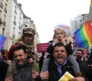 PARIS, FRANCE - DECEMBER 16: People demonstrate for the legalisation of gay marriage and parenting on December 16, 2012 in Paris, France. Demonstrations have shown a deep division in French society over the marriage equality bill expected to be passed in early 2013. The bill would not only legalize same-sex marriage but would also allow gay couples to adopt, which is seen as the most controversial issue. French President Francois Hollande, who has supported the legislation, is facing criticism from anti-gay and religious groups, while gay rights groups have warned of inadequacies within the bill. (Photo by Antoine Antoniol/Getty Images)