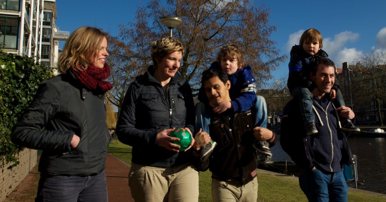 Dutch gay couples walk with their children in the Netherlands.