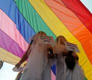 Supporters of same-sex marriage protest in wedding dresses