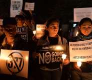 Indian LGBT activists hold placards as they demonstrate against the Supreme Court's reinstatement of Section 377, which bans gay sex in a law dating from India's colonial era, in Bangalore on January 28, 2014. India's top court January 28 rejected a plea filed by the government and activist groups to review its shock ruling which reinstated a colonial-era ban on gay sex. AFP PHOTO/Manjunath KIRAN (Photo credit should read Manjunath Kiran/AFP/Getty Images)