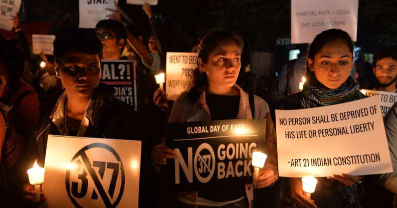 Indian LGBT activists hold placards as they demonstrate against the Supreme Court's reinstatement of Section 377, which bans gay sex in a law dating from India's colonial era, in Bangalore on January 28, 2014. India's top court January 28 rejected a plea filed by the government and activist groups to review its shock ruling which reinstated a colonial-era ban on gay sex. AFP PHOTO/Manjunath KIRAN (Photo credit should read Manjunath Kiran/AFP/Getty Images)