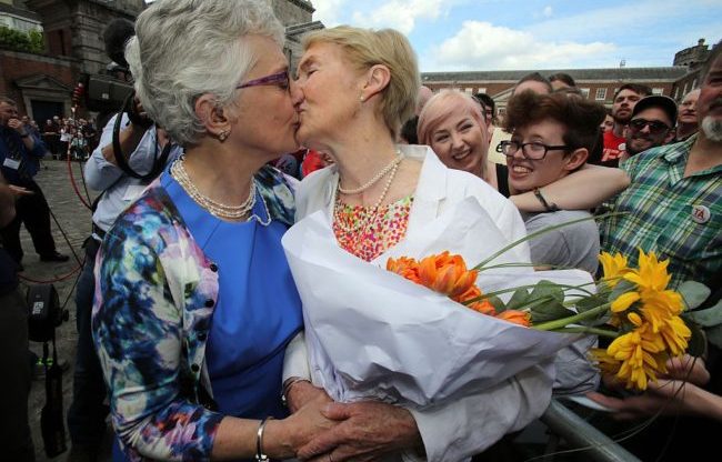 Irish Senator Katherine Zappone kisses her partner Ann Louise Gilligan following the same-sex marriage referendum in Ireland