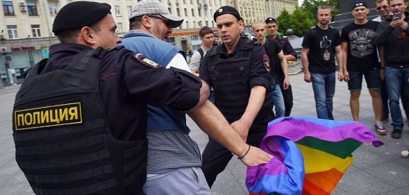 Russian riot policemen detain a gay and LGBT rights activist during an unauthorized gay rights activists rally in central Moscow on May 30, 2015. Moscow city authorities turned down demands for a gay rights rally. AFP PHOTO/DMITRY SEREBRYAKOV (Photo credit should read DMITRY SEREBRYAKOV/AFP/Getty Images)