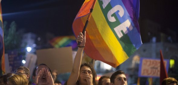 JERUSALEM, ISRAEL - AUGUST 01: Israelis and members of the gay community attend an anti-homophobia rally on August 1, 2015 in Jerusalem, Israel. Thousands of people took part in rallies across Israel to protest Thursday's stabbing attack at Jerusalem's Gay Pride parade and the West Bank arson attack in which an 18-month-old Palestinian infant was killed. (Photo by Lior Mizrahi/Getty Images)