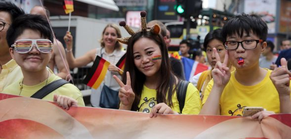 People take part in the Lesbian, Gay, Bi-sexual and Transgender (LGBT) parade in Hong Kong on November 6, 2015. Hong Kong's streets were coloured by rainbow flags as protesters marched in the city's annual gay pride parade to call for equality and same-sex marriage. AFP PHOTO / ISAAC LAWRENCE (Photo credit should read Isaac Lawrence/AFP/Getty Images)