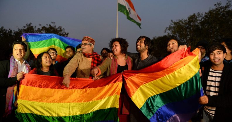 Activists are seen celebrating after India's Supreme Court agreed to lift a ban on same-sex relations.