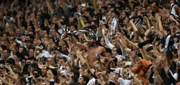 Fans of Brazil's Atletico Mineiro cheer for their team during their 2016 Libertadores Cup match against Argentina's Racing at the Independencia Stadium in Belo Horizonte, Brazil on May 4, 2016. / AFP / DOUGLAS MAGNO (Photo credit should read DOUGLAS MAGNO/AFP/Getty Images)