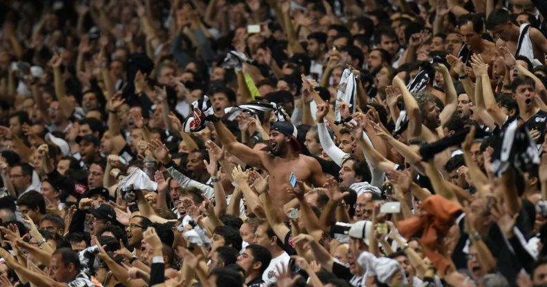 Fans of Brazil's Atletico Mineiro cheer for their team during their 2016 Libertadores Cup match against Argentina's Racing at the Independencia Stadium in Belo Horizonte, Brazil on May 4, 2016. / AFP / DOUGLAS MAGNO (Photo credit should read DOUGLAS MAGNO/AFP/Getty Images)