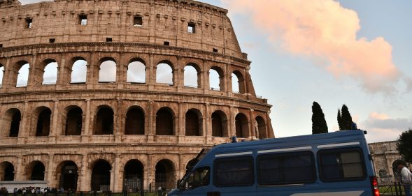 This photo taken on May 12, 2016 in Rome shows an Italian police van stationed outside of the Colosseum