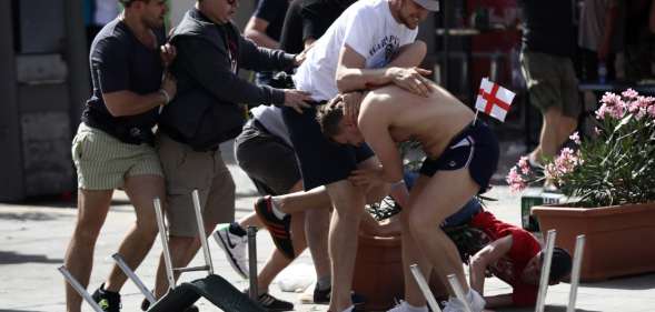 MARSEILLE, FRANCE - JUNE 11: England fans clash with Russian fans ahead of the game against Russia later today on June 11, 2016 in Marseille, France. Football fans from around Europe have descended on France for the UEFA Euro 2016 football tournament. (Photo by Carl Court/Getty Images)