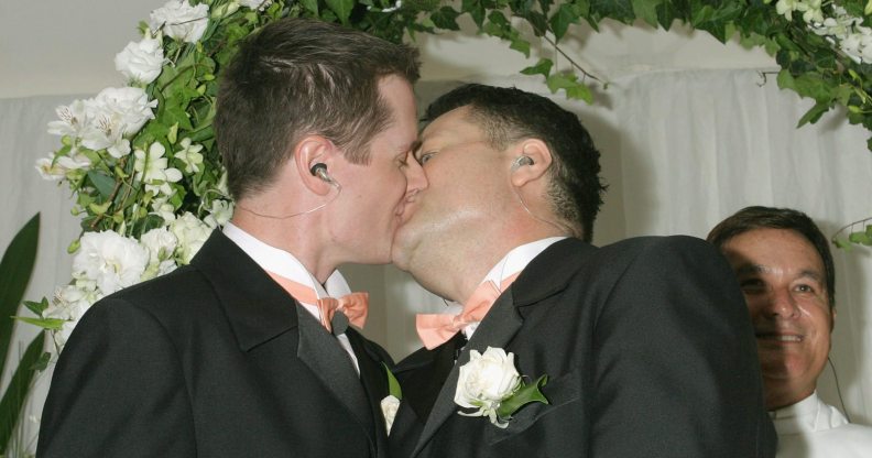 SYDNEY, NSW - NOVEMBER 25: Geoff Field (R) and Jason Kerr (L) kiss after marrying at Sydney's First Illegal Gay Wedding at Circular Quay November 25, 2005 in Sydney, Australia. (Photo by Stephane L'hostis/Getty Images)