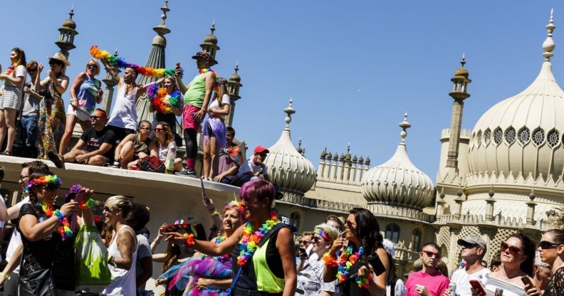 BRIGHTON, ENGLAND - AUGUST 06: People line the streets to watch the Brighton Pride Parade on August 6, 2016 in Brighton, England. (Photo by Tristan Fewings/Getty Images)