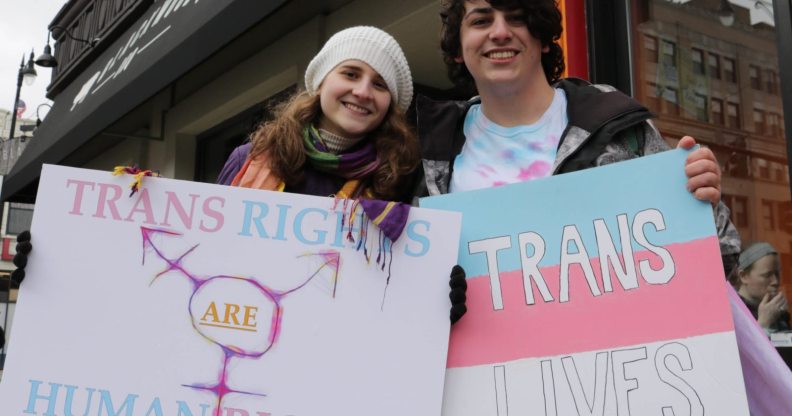 Transgender student Sorrel Rosin (R) poses with a friend February 25 2017 in Chicago as hundreds of transgender supporters protest against the Trump administration's reversal of federal protections of bathroom rights, warning it risked exposing young people to hate-fueled violence. Rosin, a high school student in Illinois, said Ive felt a spike in homophobia, transphobia, bigotry, misogyny in and out of school." / AFP / Derek R. HENKLE (Photo credit should read DEREK R. HENKLE/AFP/Getty Images)