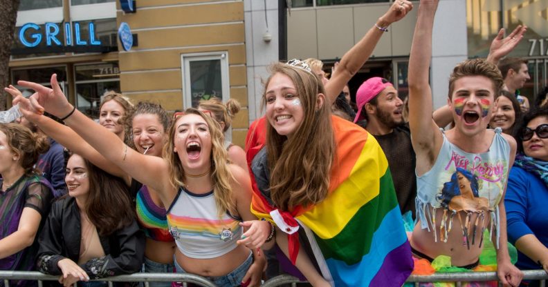 Ciara Hall (L) cheers with friends during the San Francisco Pride parade in San Francisco, California on Sunday, June, 25, 2017. / AFP PHOTO / Josh Edelson (Photo credit should read JOSH EDELSON/AFP/Getty Images)