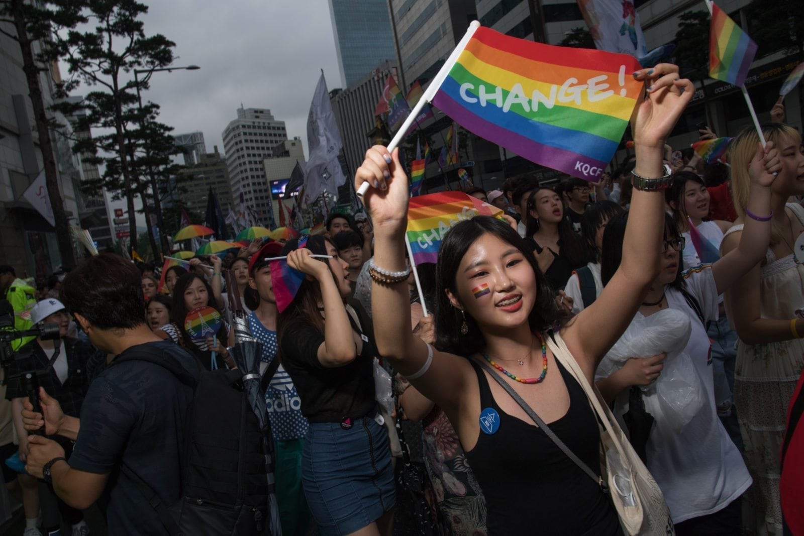 Participants march along a street during a 'Gay Pride' march in Seoul on July 15, 2017. Thousands of people celebrated gay rights with song, dance and a march in Seoul on July 15, amid rain and boisterous protests by conservative Christians. Religious South Koreans have been a loud fixture at the annual parade for years, holding a rival anti-homosexuality rally while trying to physically block the march. / AFP PHOTO / Ed JONES (Photo credit should read ED JONES/AFP/Getty Images)