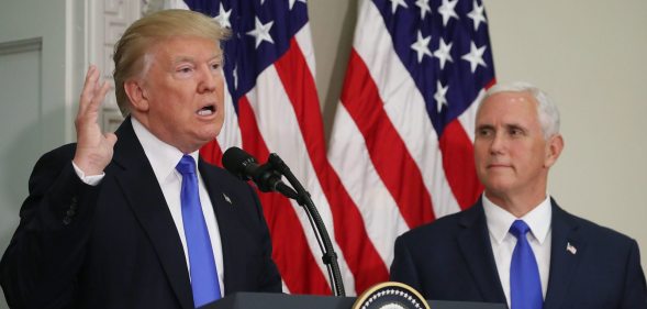 WASHINGTON, DC - JULY 19: U.S. President Donald Trump speaks while flanked by US Vice President Mike Pence during the first meeting of the Presidential Advisory Commission on Election Integrity in the Eisenhower Executive Office Building, on July 19, 2017 in Washington, DC. (Photo by Mark Wilson/Getty Images)