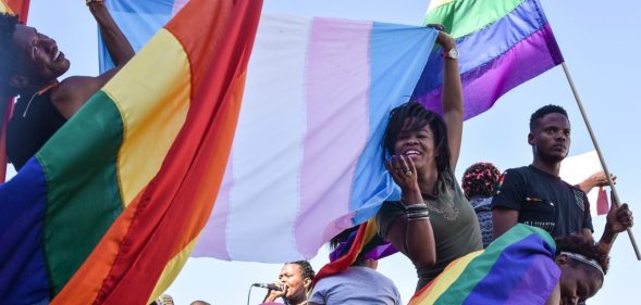 Dozens of people cheer and dance as they take part in the Namibian Lesbians, Gay, Bisexual and Transexual (LGBT) community pride Parade in the streets of the Namibian Capitol on July 29, 2017 in Windhoek. Even though there have been marches and protests against discrimination against the LGBT community in the past years, this is the first time that the community held such a parade along the capital's main street, Independence Avenue, to celebrate their identity and rights. / AFP PHOTO / Hildegard Titus (Photo credit should read HILDEGARD TITUS/AFP/Getty Images)