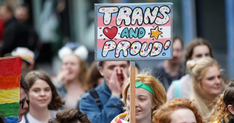 GLASGOW, SCOTLAND - AUGUST 19: A participant holds a sign saying "Trans and Proud" during the Glasgow Pride march on August 19, 2017 in Glasgow, Scotland. The largest festival of LGBTI celebration in Scotland has been held every year in Glasgow since 1996. (Photo by Robert Perry/Getty Images)