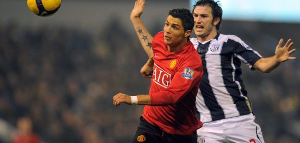 Manchester United's Portuguese midfielder Cristiano Ronaldo (L) vies with West Bromwich Albion's Belgium defender Carl Hoefkens during the English Premier league football match at The Hawthorns, West Bromwich, central England, on January 27, 2009. AFP PHOTO/ANDREW YATES FOR EDITORIAL USE ONLY Additional licence required for any commercial/promotional use or use on TV or internet (except identical online version of newspaper) of Premier League/Football League photos. Tel DataCo +44 207 2981656. Do not alter/modify photo. (Photo credit should read ANDREW YATES/AFP/Getty Images)