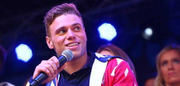 NEW YORK, NY - NOVEMBER 01: skier Gus Kenworthy speaks during the 100 Days Out 2018 PyeongChang Winter Olympics Celebration - Team USA in Times Square on November 1, 2017 in New York City. (Photo by Mike Stobe/Getty Images for USOC)