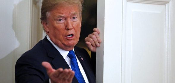 WASHINGTON, DC - NOVEMBER 02: (AFP OUT) U.S. President Donald Trump gestures to reporters after joining Broadcom CEO Hock Tan in announcing the repatriation of Tan's company headquarters to the United States from Singapore during a ceremony in the Oval Office of the White House, in Washington, DC, 11-2-17. At left is Rep. Kevin McCarthy (R-CA). (Photo by Martin H. Simon - Pool/Getty Images)