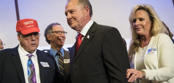 BIRMINGHAM, AL - NOVEMBER 16: Republican candidate for U.S. Senate Judge Roy Moore and his wife Kayla Moore exit a news conference with supporters and faith leaders, November 16, 2017 in Birmingham, Alabama. Moore refused to answer questions regarding sexual harassment allegations and pursuing relationships with underage women. (Drew Angerer/Getty Images)