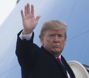 US President Donald Trump waves from Air Force One prior to departure from Andrews Air Force Base in Maryland, December 4, 2017, as Trump travels to Salt Lake City, Utah. / AFP PHOTO / SAUL LOEB (Photo credit should read SAUL LOEB/AFP/Getty Images)