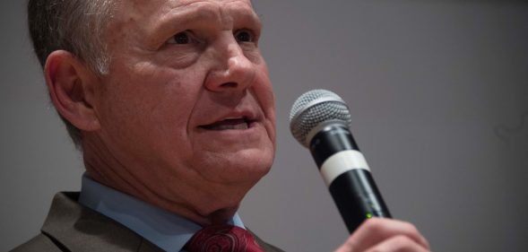 Republican Senatorial candidate Roy Moore addresses his supporters in Montgomery, Alabama, on December 12, 2017. Democrat Doug Jones scored a victory Tuesday in a fiercely contested US Senate race in conservative Alabama, dealing a setback to US President Donald Trump, whose candidate could not overcome damaging sexual misconduct accusations. With 92 percent of precincts reporting, former prosecutor Jones secured 49.5 percent of the vote compared to Roy Moore's 48.8 percent, CNN and other networks reported. / AFP PHOTO / JIM WATSON (Photo credit should read JIM WATSON/AFP/Getty Images)