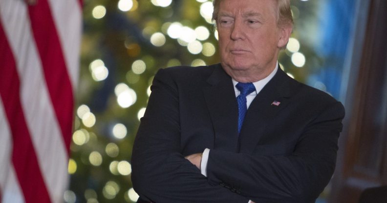 WASHINGTON, DC - DECEMBER 13: U.S. President Donald Trump listens to a group of families, Young Republicans and College Republicans at the White House, while speaking about how planned tax reforms would benefit middle class families . (Photo by Chris Kleponis-Pool/Getty Images)