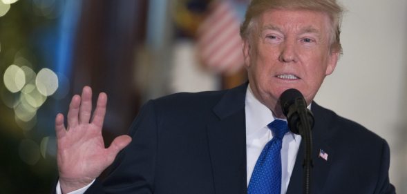 WASHINGTON, DC - DECEMBER 13: U.S. President Donald Trump speaks to a group of families, Young Republicans and College Republicans at the White House on December 13, 2017 in Washington, DC. House and Senate Republicans are working on a tentative deal on tax reform that will overhaul the U.S. tax system. (Photo by Chris Kleponis-Pool/Getty Images)