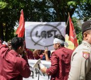 A group of Muslim protesters march with banners against the lesbian, gay, bisexual and transgender (LGBT) community in Banda Aceh on Decmber 27, 2017