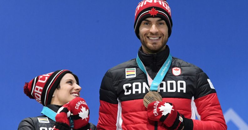 Canada's bronze medallists Meagan Duhamel (L) and Eric Radford pose on the podium during the medal ceremony for the figure skating pair event at the Pyeongchang Medals Plaza during the Pyeongchang 2018 Winter Olympic Games in Pyeongchang on February 15, 2018. / AFP PHOTO / Dimitar DILKOFF (Photo credit should read DIMITAR DILKOFF/AFP/Getty Images)