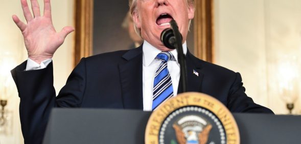 TOPSHOT - US President Donald Trump speaks about the spending bill during a press conference in the Diplomatic Reception Room at the White House on March 23, 2018. / AFP PHOTO / Nicholas Kamm (Photo credit should read NICHOLAS KAMM/AFP/Getty Images)