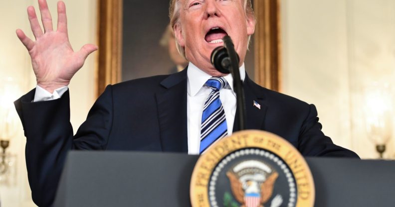 TOPSHOT - US President Donald Trump speaks about the spending bill during a press conference in the Diplomatic Reception Room at the White House on March 23, 2018. / AFP PHOTO / Nicholas Kamm (Photo credit should read NICHOLAS KAMM/AFP/Getty Images)