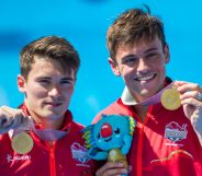 England's Thomas Daley (R) and Daniel Goodfellow pose with their gold medals after the men's synchronised 10m platform diving in the 2018 Gold Coast Commonwealth Games at the Optus Aquatic Centre on the Gold Coast on April 13, 2018 / AFP PHOTO / François-Xavier MARIT / The erroneous mention[s] appearing in the metadata of this photo by François-Xavier MARIT has been modified in AFP systems in the following manner: [gold medals] instead of [silver medals (as previously corrected)]. Please immediately remove the erroneous mention[s] from all your online services and delete it (them) from your servers. If you have been authorized by AFP to distribute it (them) to third parties, please ensure that the same actions are carried out by them. Failure to promptly comply with these instructions will entail liability on your part for any continued or post notification usage. Therefore we thank you very much for all your attention and prompt action. We are sorry for the inconvenience this notification may cause and remain at your disposal for any further information you may require. (Photo credit should read FRANCOIS-XAVIER MARIT/AFP/Getty Images)