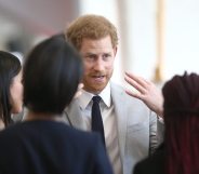 LONDON, UNITED KINGDOM - APRIL 18: Prince Harry and Meghan Markle speak with delegates from the Commonwealth Youth Forum at the Queen Elizabeth II Conference Centre, during the Commonwealth Heads of Government Meeting on April 18, 2018 in London, United Kingdom (Photo by Yui Mok - WPA Pool/Getty Images)