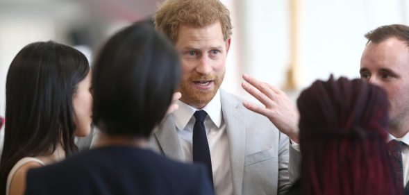 LONDON, UNITED KINGDOM - APRIL 18: Prince Harry and Meghan Markle speak with delegates from the Commonwealth Youth Forum at the Queen Elizabeth II Conference Centre, during the Commonwealth Heads of Government Meeting on April 18, 2018 in London, United Kingdom (Photo by Yui Mok - WPA Pool/Getty Images)